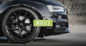 Black car with new wheels and tyres